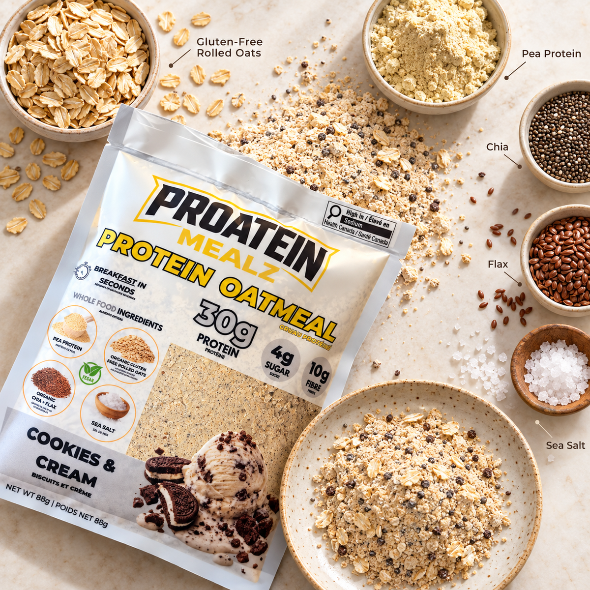 Proatein Mealz Protein Oatmeal Cookies & Cream flavor in a stand-up pouch, styled in a flat-lay with bowls of oats, pea protein, chia, flax, sea salt, and the prepared granola mixture on a light beige surface.